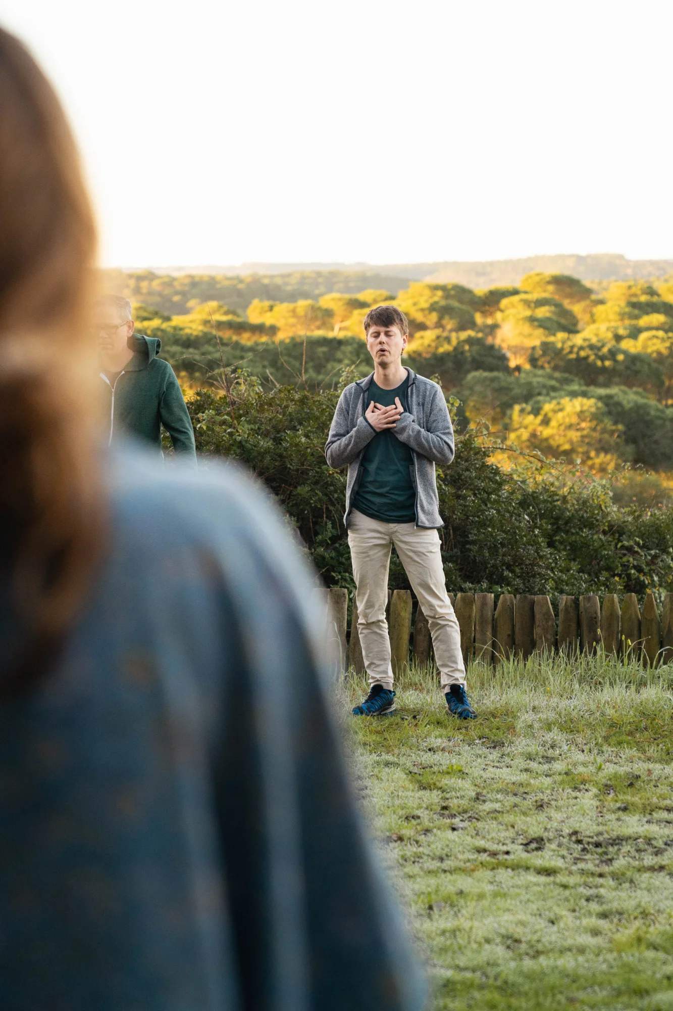 Jacob with his hands on his heart, sounding at golden hour.
